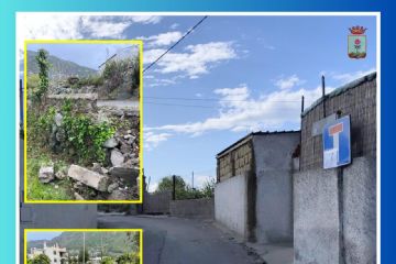 Fotografia di via Pietra e del muro crollato